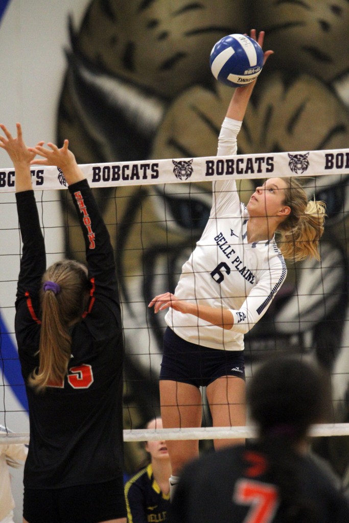 Belle Plaine’s Alyssa Tegeler scores a kill in volleyball action against Springville.