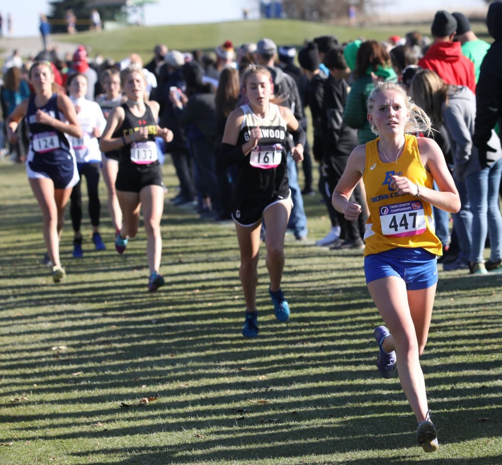 Hailee Ricklefs runs at the state cross country meet for Benton Community. Photo by CJ Eilers.